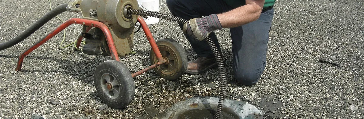 sewer rodding technician actively removing blockages from a sewer line in Bellevue, WA